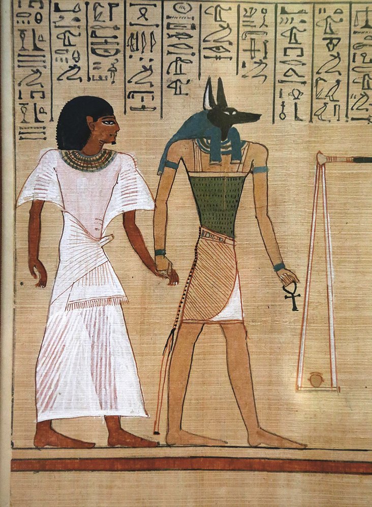 Anubis, egyptský bůh se šakalí hlavou, doprovázel duše zemřelých do podsvětí