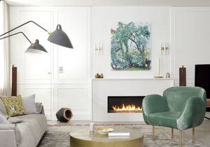 The interior of the five-room apartment is bright, pastel colors and gold details stand out.