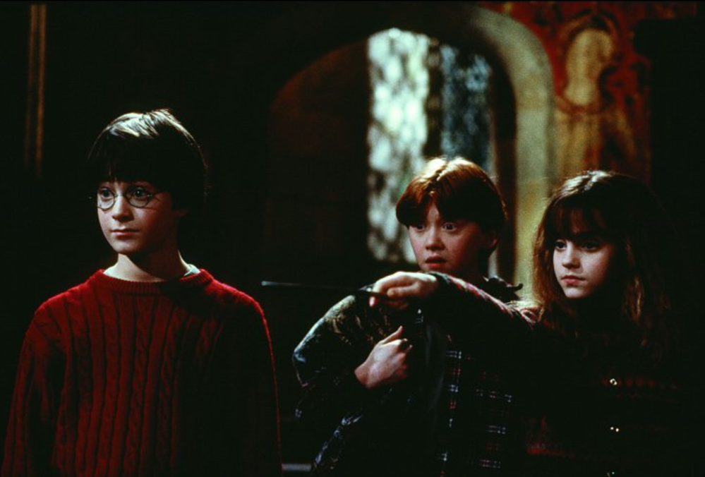 Daniel Radcliffe, Rupert Grint a Emma Watsonová ve filmu Harry Potter a Kámen mudrců